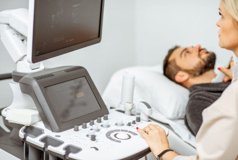 Doctor using machine to look at patient